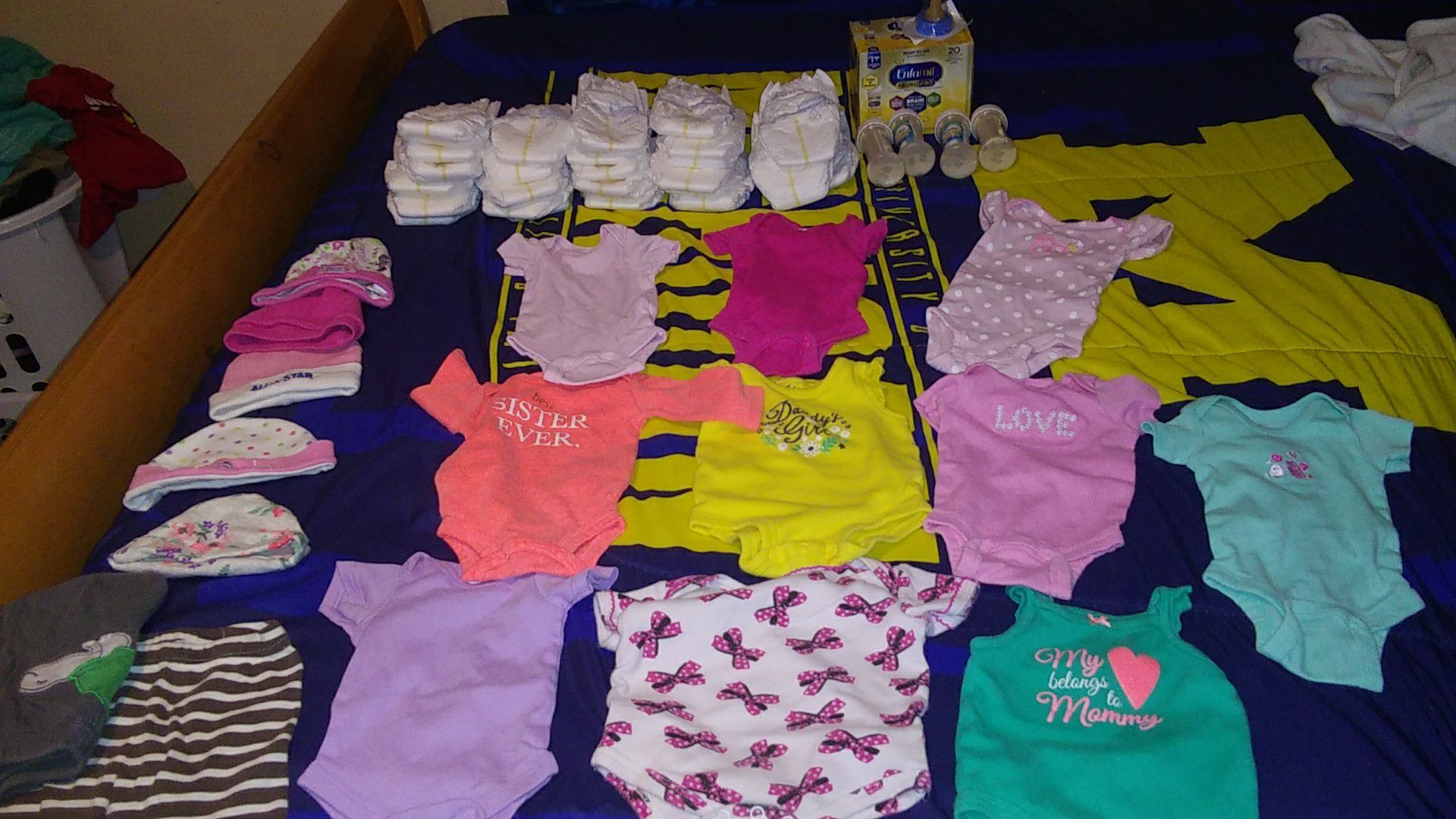 Newborn clothes with diapers and formula