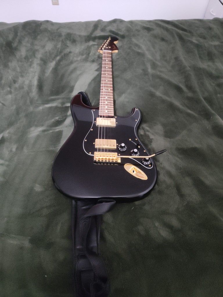 Fender Electric Guitar With Case And Strap