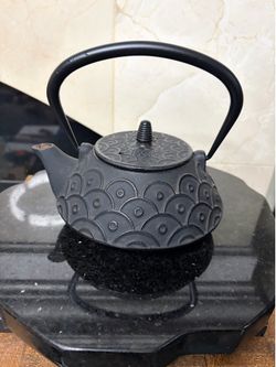 Black cast iron teapot