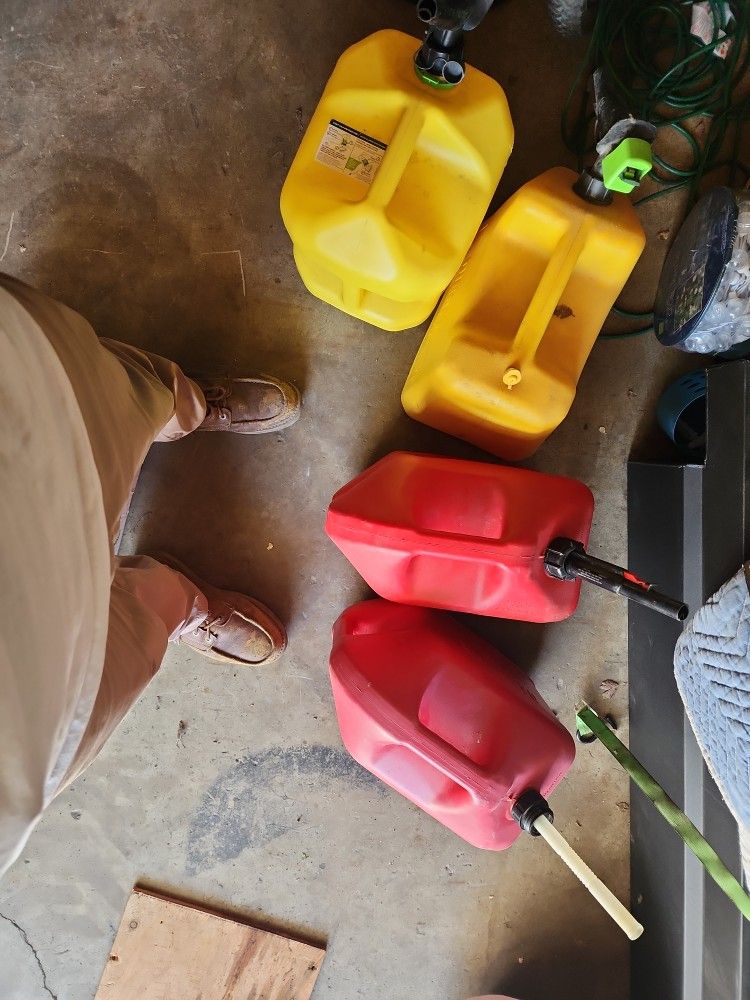 Four Of The Five Gallon Gas Tanks For Diesel Or Regular Gas