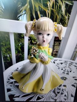 Vintage Mold of Large Doll with Flower in Her Arms
