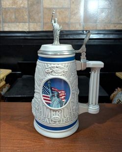 1998 Avon "America the Beautiful" large ceramic beer stein featuring an embossed Statue of Liberty on top of lid