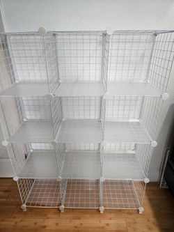 New 12 Cube organizer already assembled comes with 6 white bins and 6 black bins  Height 4 feet width 3 feet