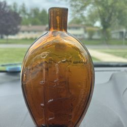 Clevenger Bros. Glass Works Clayton NJ Amber Glass Bottle with an Eagle & Grapes