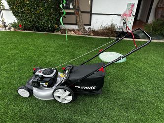 New Murray push lawn mower. Has Briggs and Stratton 140cc gas engine. Features 21 inch cutting width and height adjustment. Includes mulch bag. Engine