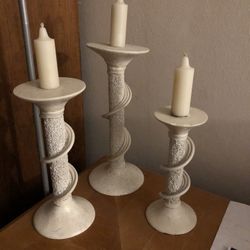 Three Candle Holders With Candles 