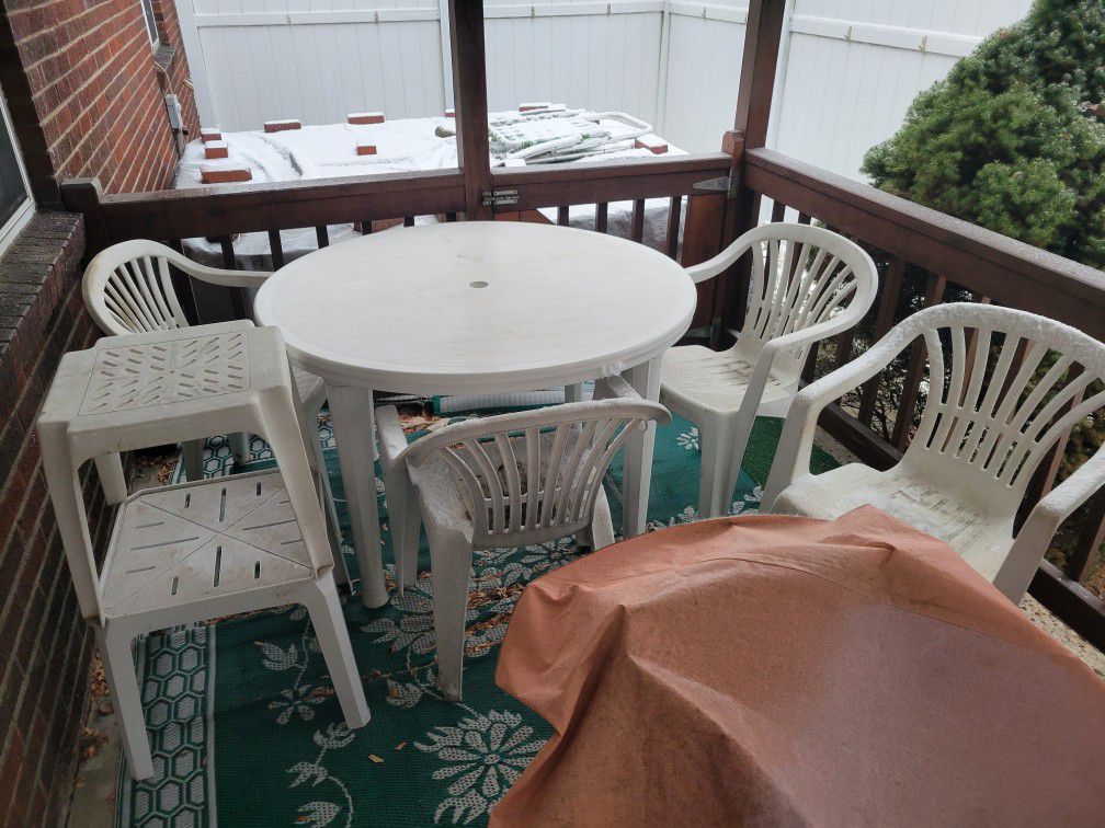 Outdoor Patio Table And Chairs With A New Umbrella And Cover  , Italian Design Bedroom Furniture Set That Is Black And Brown Swirl Design And Is Very 