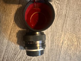 50 Mm Minolta Camera Lens And Electroflash