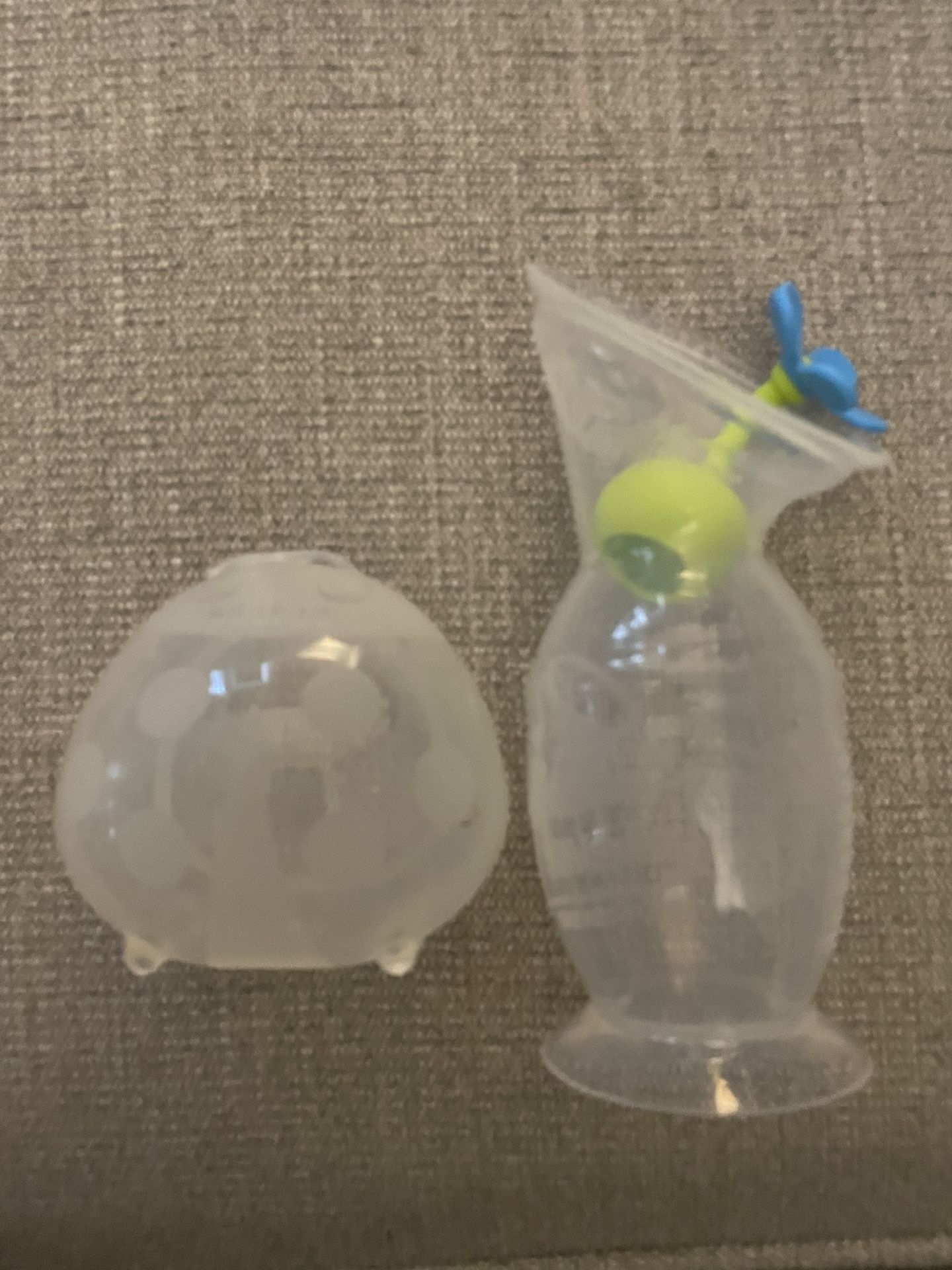 Haakaa Breast Pump with Suction Base and Flower Stopper and Haakaa Ladybug