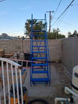 A vistel 9 step Blue Rolling Steel Warehouse Ladder