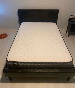 Full size bed with non used Sally full size matress