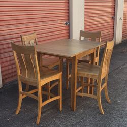 5-piece table and 4 counter height chairs dining oak. Table have 2 side folding down wings""NEW""