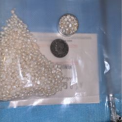 One Container Of Sewing Pearls  Or Beads 