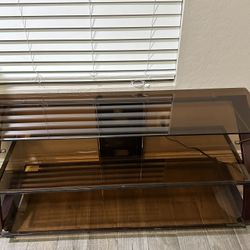 TV Stand ,  Entretainment Glass , Holds Up To 65 “ Tv. 