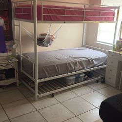 Bunk beds with an extra support on the bottom for mattress 