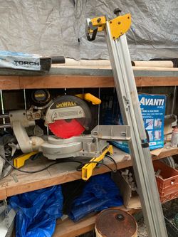 12 inch Dewalt chop saw with stand and many new blades