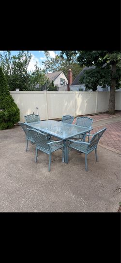 Outdoor glass table and chairs and umbrella