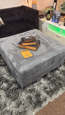 Grey Ottoman by Ashley Furn.