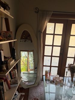 full length wavy mirror and coffee table