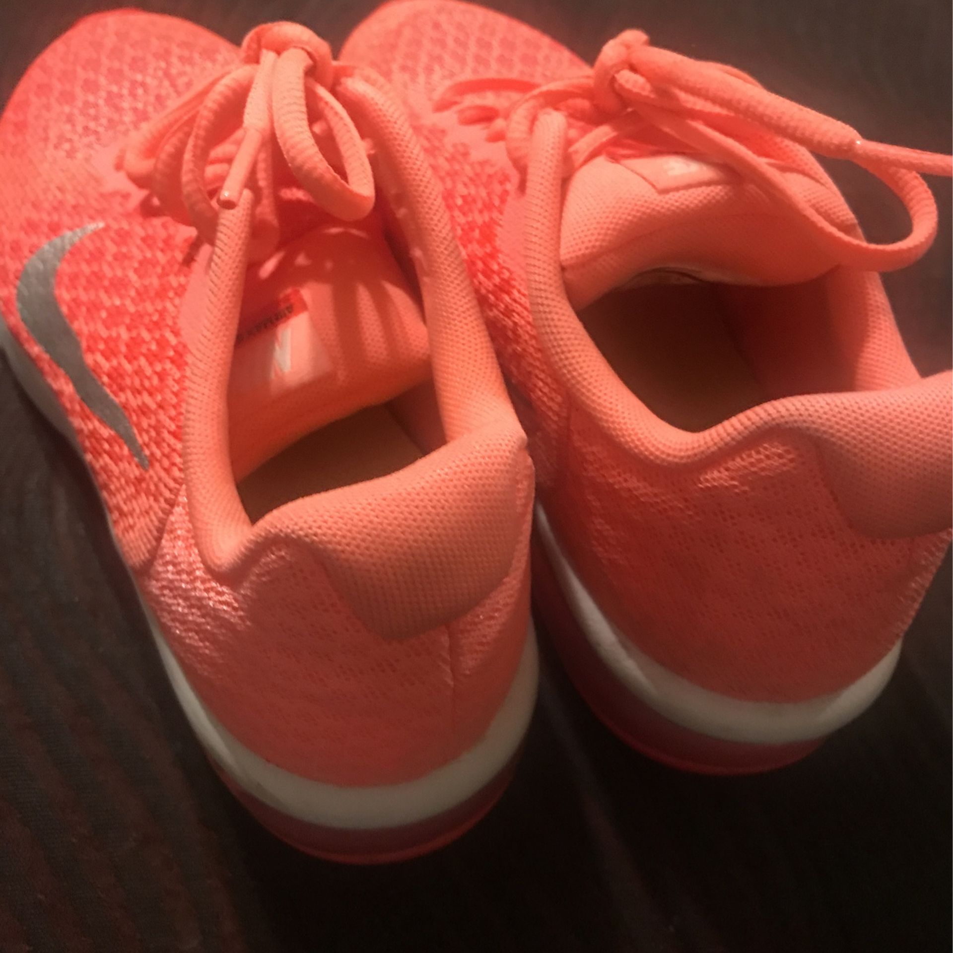 peach color nike shoes