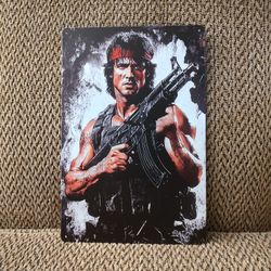 RAMBO METAL SIGN.  12" X 8".  NEW.  PICKUP ONLY.