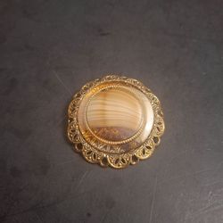Vintage 50's To 60's Victorian Style Brooch Intricate Goldtone Filagree Frame Features A Banded Agate Or Glass Cabochon, Stamped Western Germany 1.75"