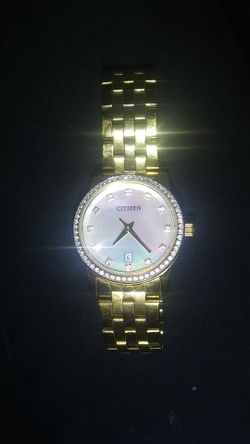 Authenic Citizen lady watch with swarovski crystals and mother of pearl face.
