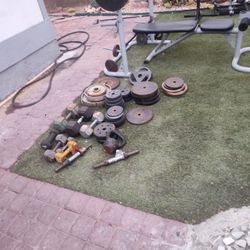Weight Set Lots Of Weight And Bars And Bench Press Paded Part For Doing 