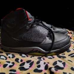 Nike Air Jordan Son of Mars "Marvin the Martian" sneaker in a black, gym red, cool grey, and green pulse colorway. 