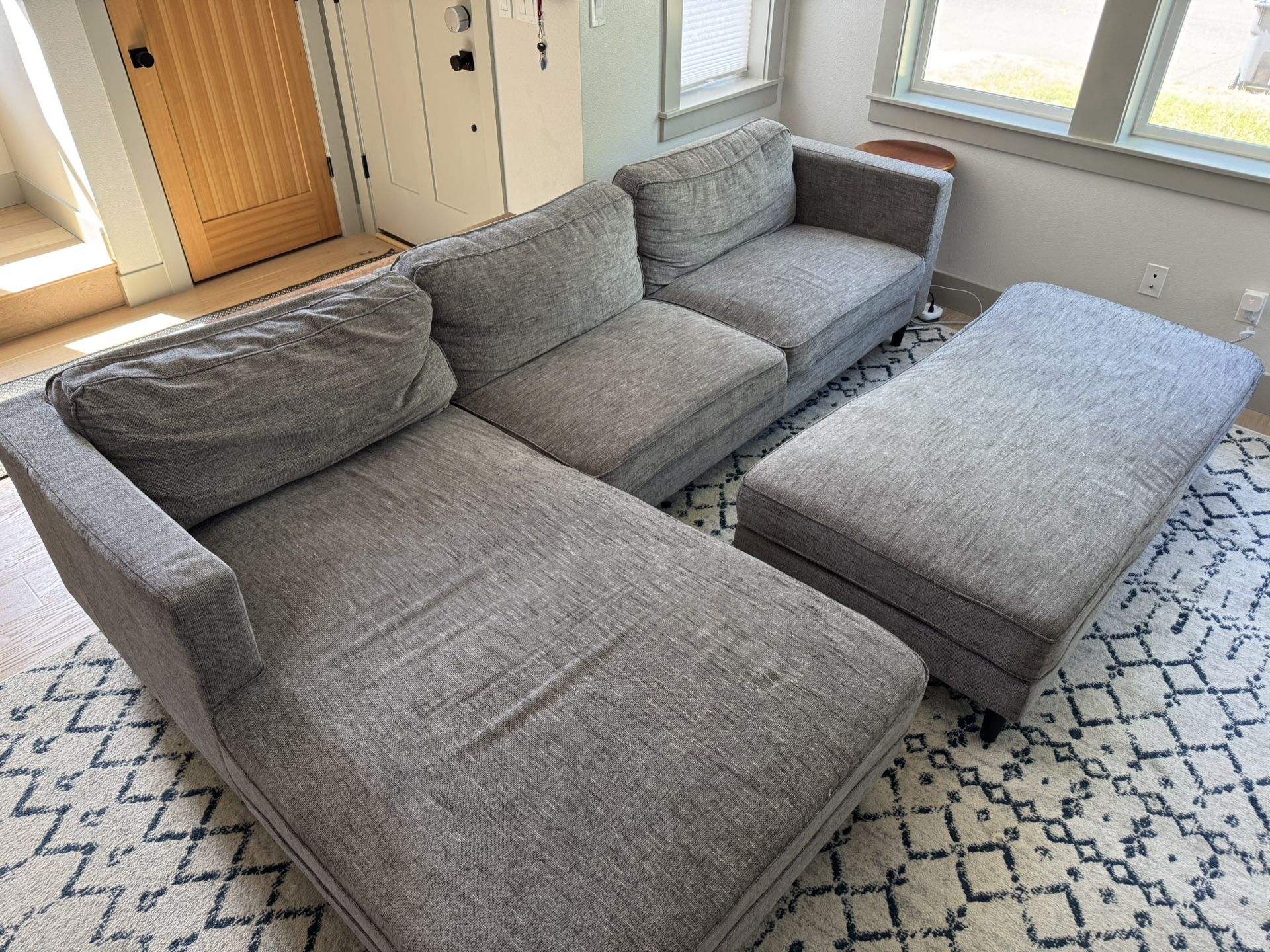Grey Couch Sectional Sofa And Ottoman (Living Spaces Cosmo)