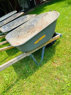 Durable steel wheelbarrow. Blue. The Spare Tires: Two matching black pneumatic tires with grey metal hubs . $55