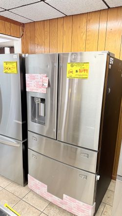 FOUR-DOOR STAINLESS STEEL SAMSUNG REFRIGERATOR WITH WARRANTY