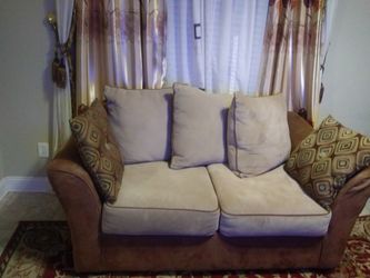 Brown sofa and match love seat