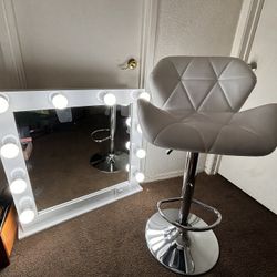 vanity mirror and white chair 
