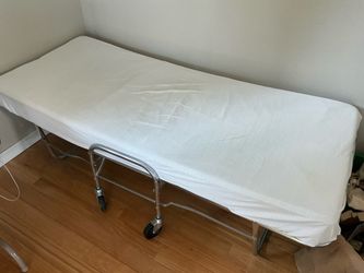 Folding portable bed.
