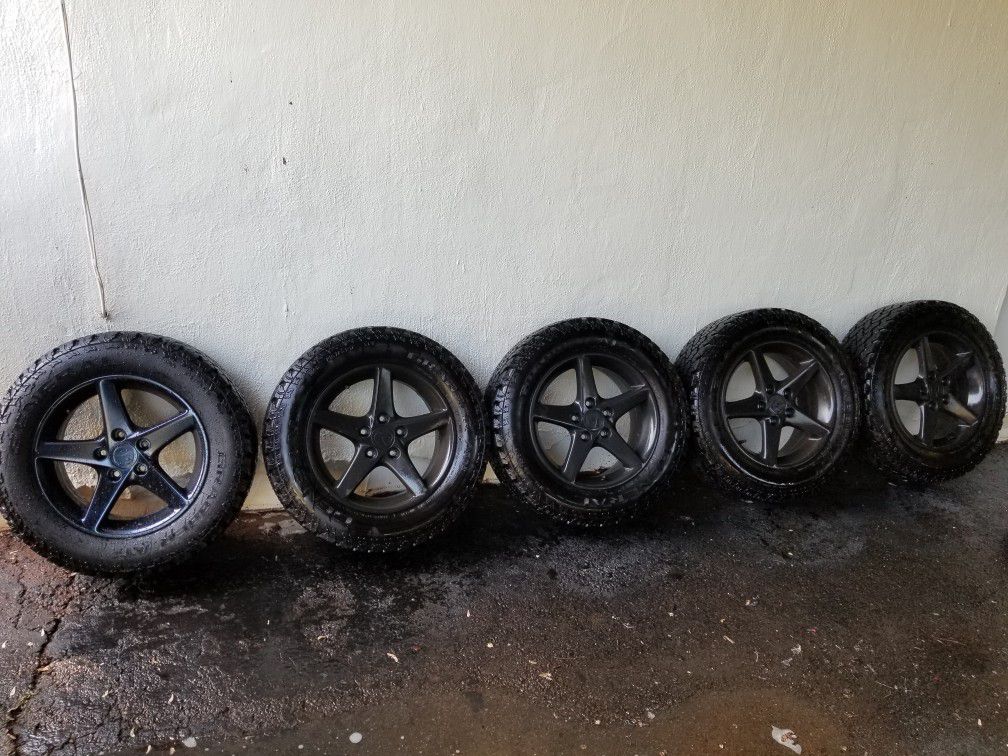 5) 215 65 16 general grabber at2 tires on rsx wheels. Plasti dipped black.