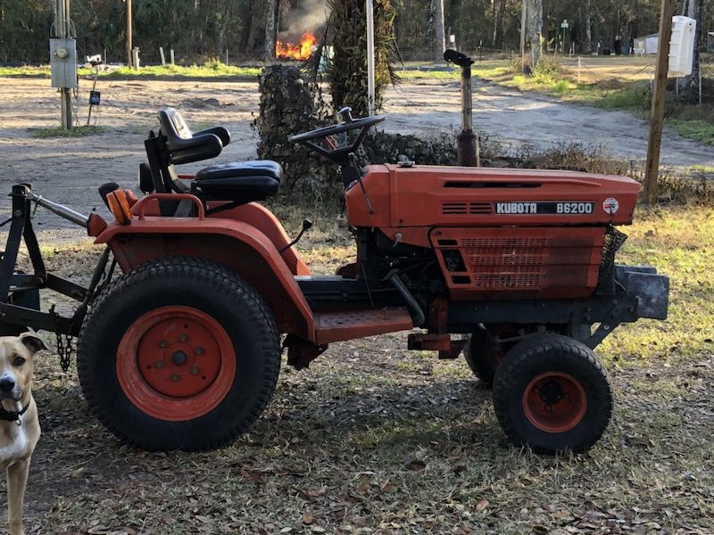 Kubota B6200 tractor with box blade and row maker