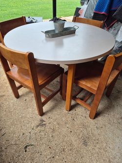 Round table and 4 wooden chairs