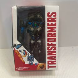 The image shows a Transformers Age of Extinction Lockdown One-Step Changer figure by Hasbro