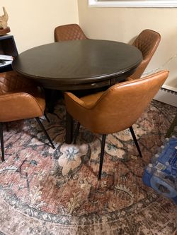 Table chairs and rug