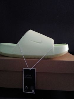 Woman's Nike calm slides size 9 light green