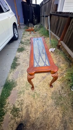 Glass-top claw-foot table