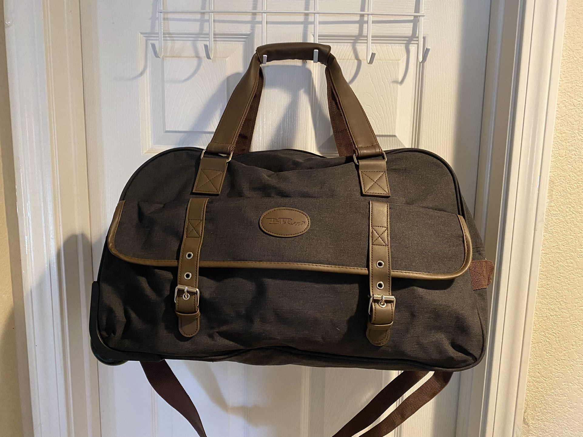 BELLA RUSSO DUFFLE BAG WITH WHEELS BLACK, GRAY, BROWN TRIM PERFECT TRAVEL BAG! PRICE NEGOTIABLE
