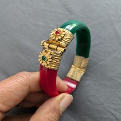 Vintage Pure Silver, GoldPlated Bold Red & Green Bracelet. Captivating Center Stones. Statement Piece, Timeless! Blending Classic Elegance.

This vint