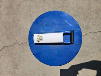 Can Crusher on a lid for a trash can