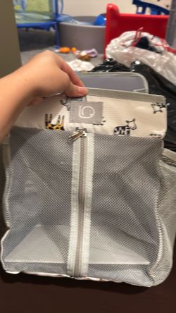 Diaper bag hanging rack on crib