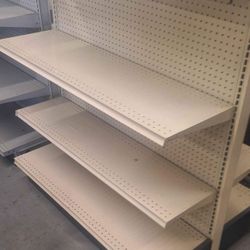 Gondola double sided shelves lozier brand  60inches in height beige color  w/16 inch base  with 3 shelves plus base on each side $250 every 4ft (