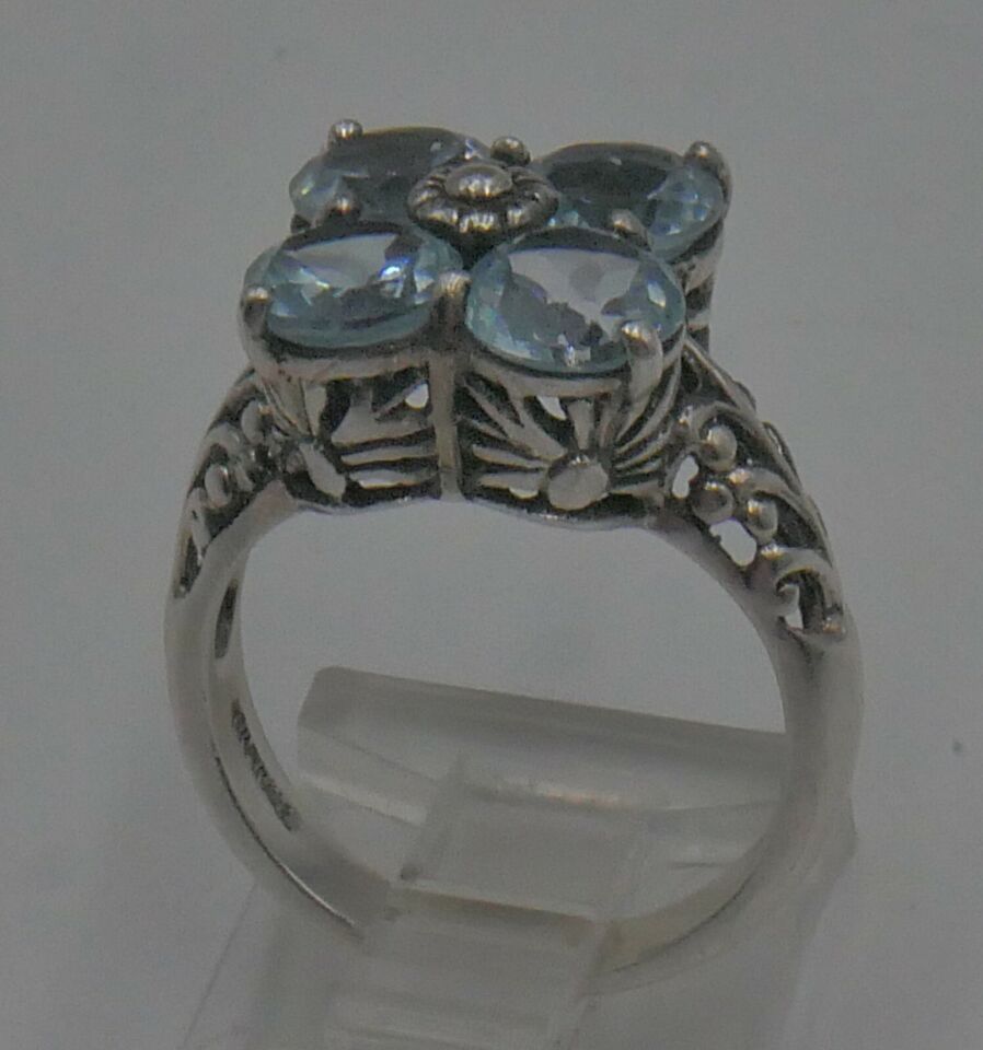 STERLING SILVER 925 RING 4.5 GRAMS SIZE 6 WITH 4 LIGHT BLUE STONES MINT