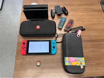 Nintendo switch with accessories and game animal crossing