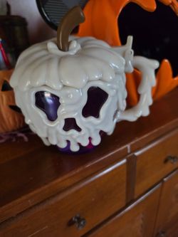 This is the Disney Parks Glow-in-the-Dark Purple Poison Apple Stein,